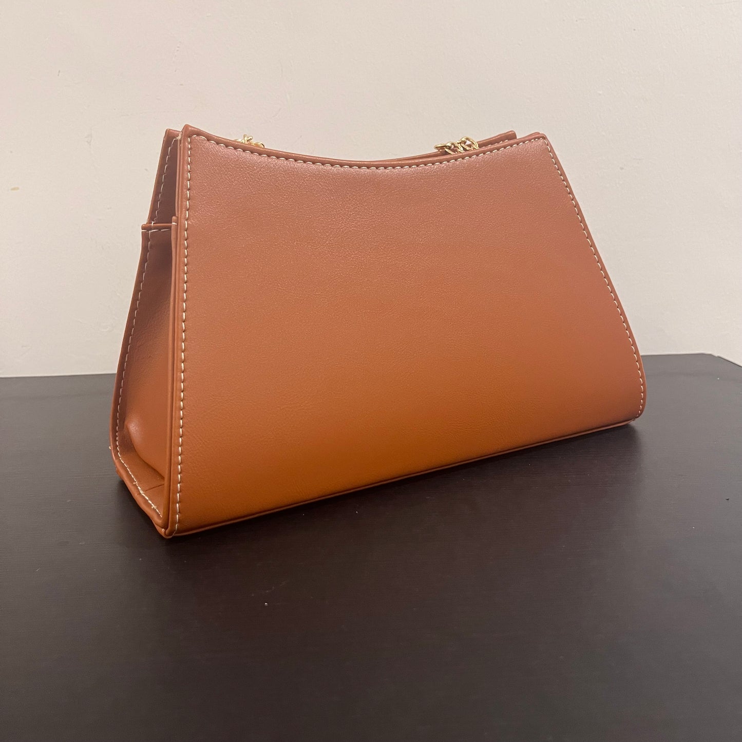 حقيبة لون بني بنمط أحرف Monogram patterned brown color handbag