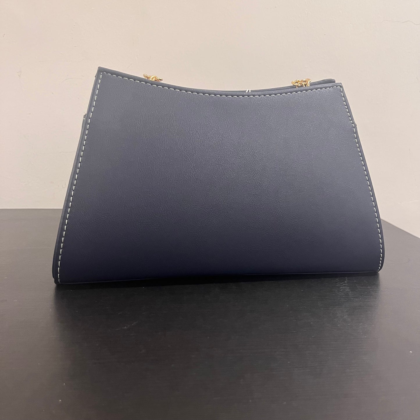 حقيبة لون كحلي بنمط أحرف Monogram patterned navy blue color handbag