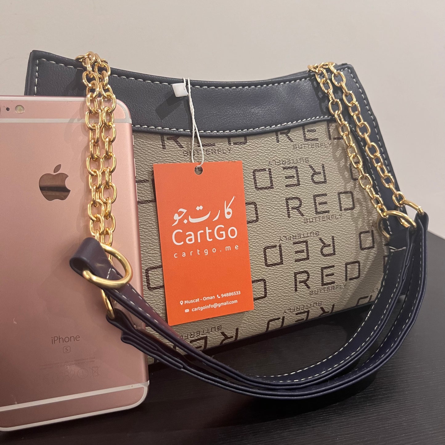 حقيبة لون كحلي بنمط أحرف Monogram patterned navy blue color handbag
