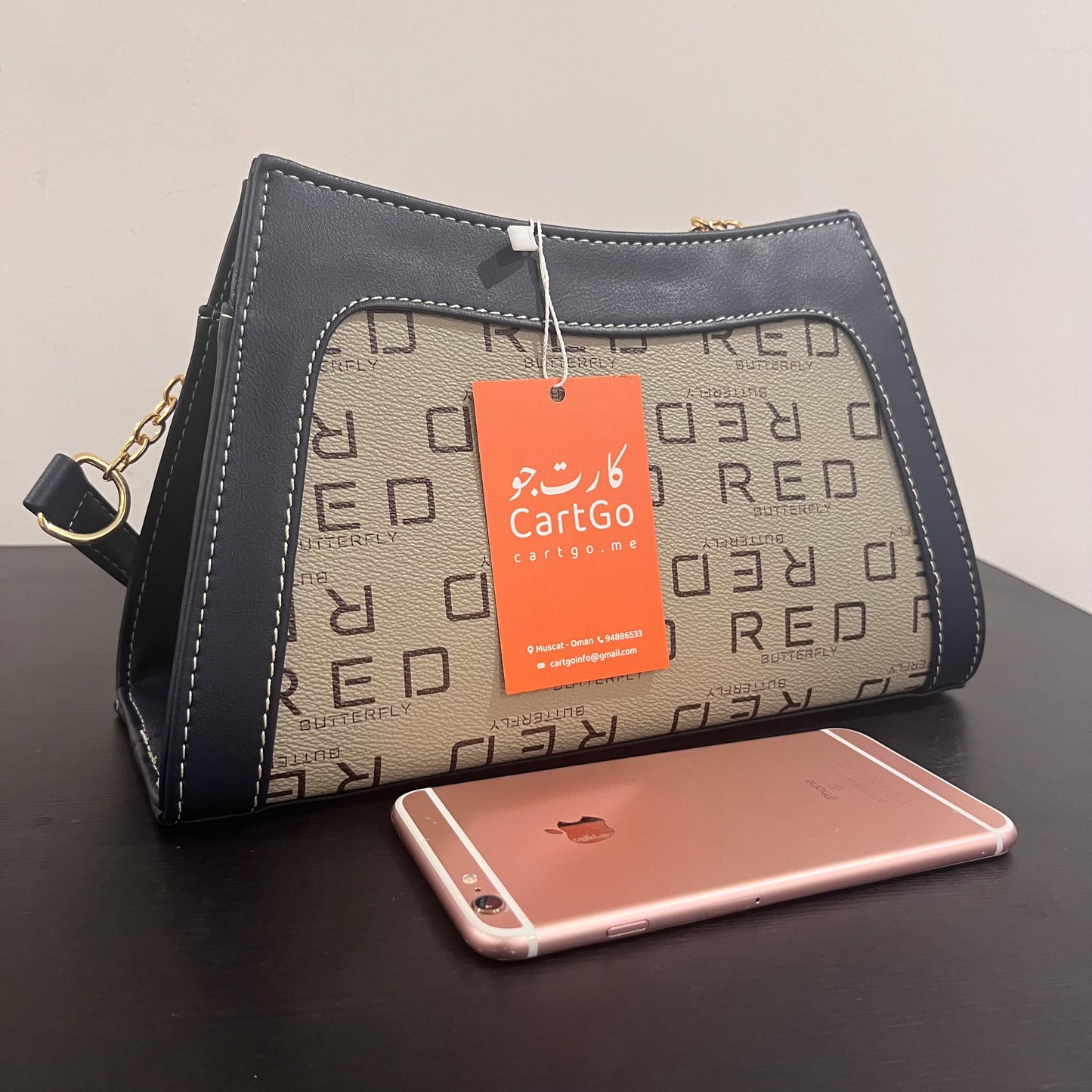 حقيبة لون كحلي بنمط أحرف Monogram patterned navy blue color handbag