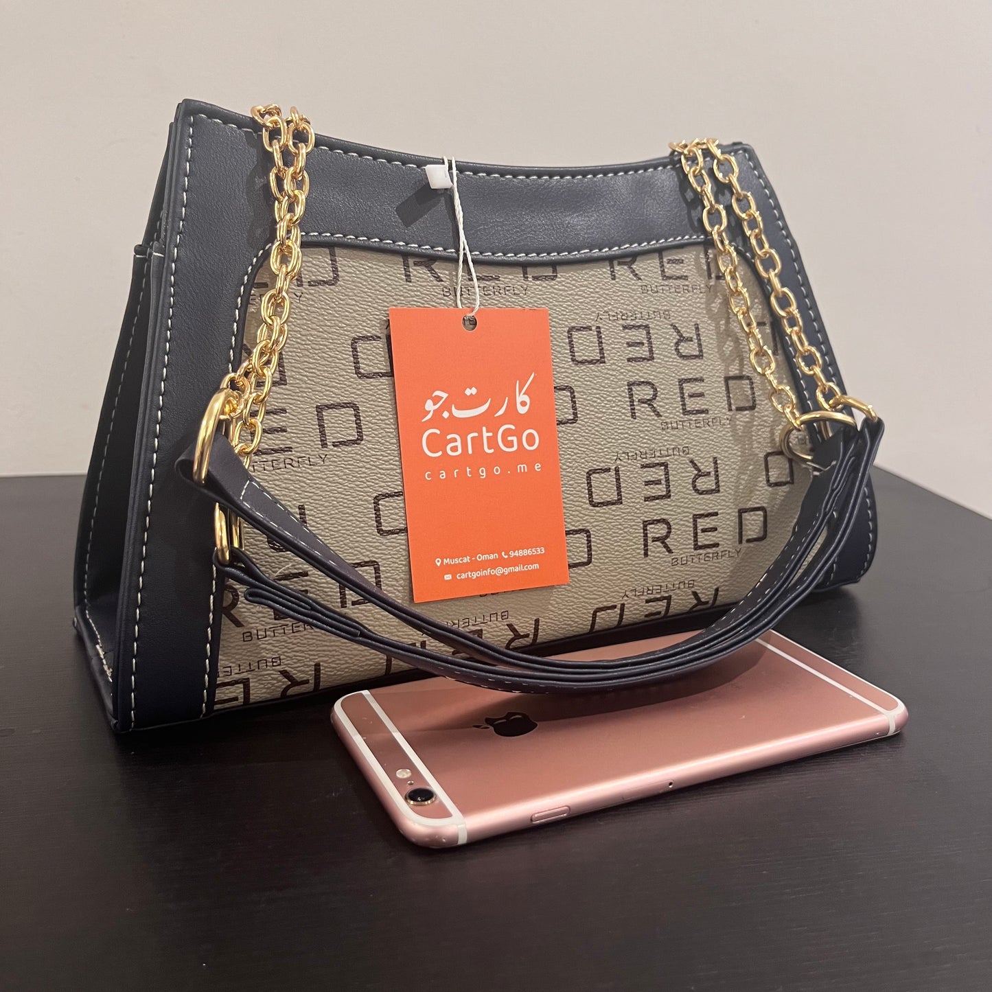 حقيبة لون كحلي بنمط أحرف Monogram patterned navy blue color handbag