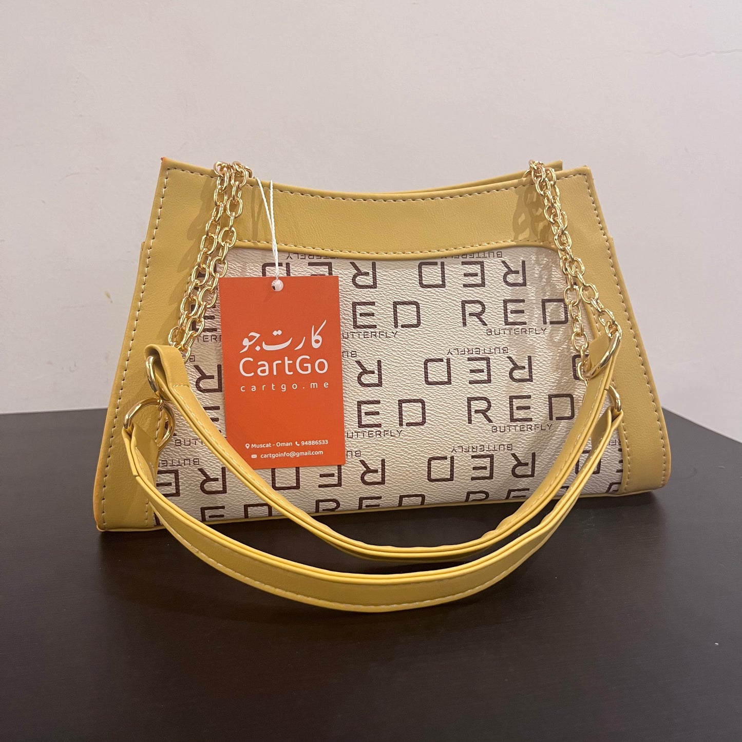 حقيبة لون خردلي بنمط أحرف Monogram patterned masterd color handbag