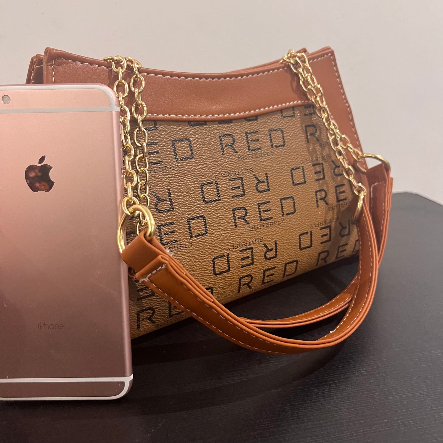 حقيبة لون بني بنمط أحرف Monogram patterned brown color handbag