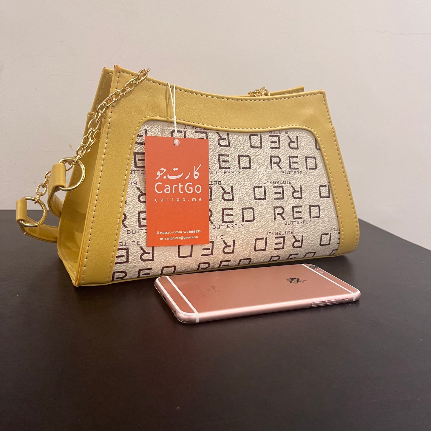حقيبة لون خردلي بنمط أحرف Monogram patterned masterd color handbag