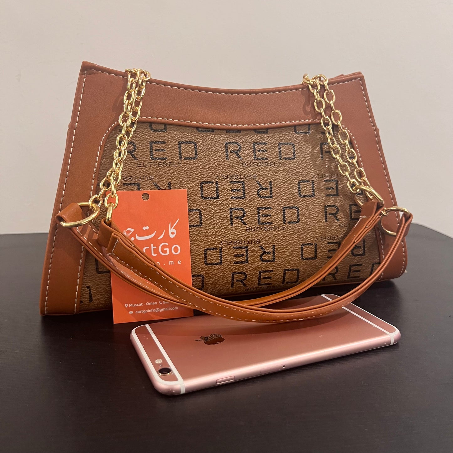 حقيبة لون بني بنمط أحرف Monogram patterned brown color handbag