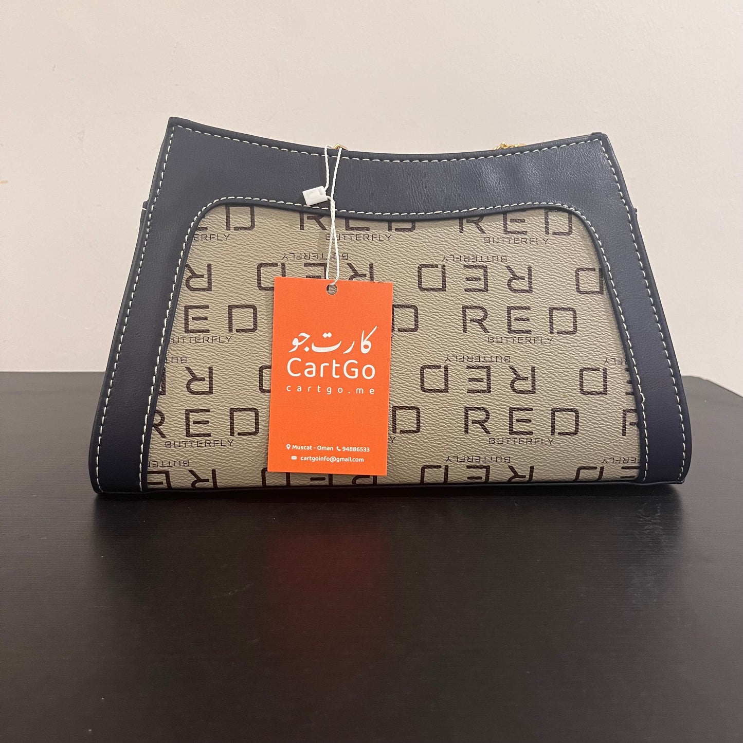 حقيبة لون كحلي بنمط أحرف Monogram patterned navy blue color handbag