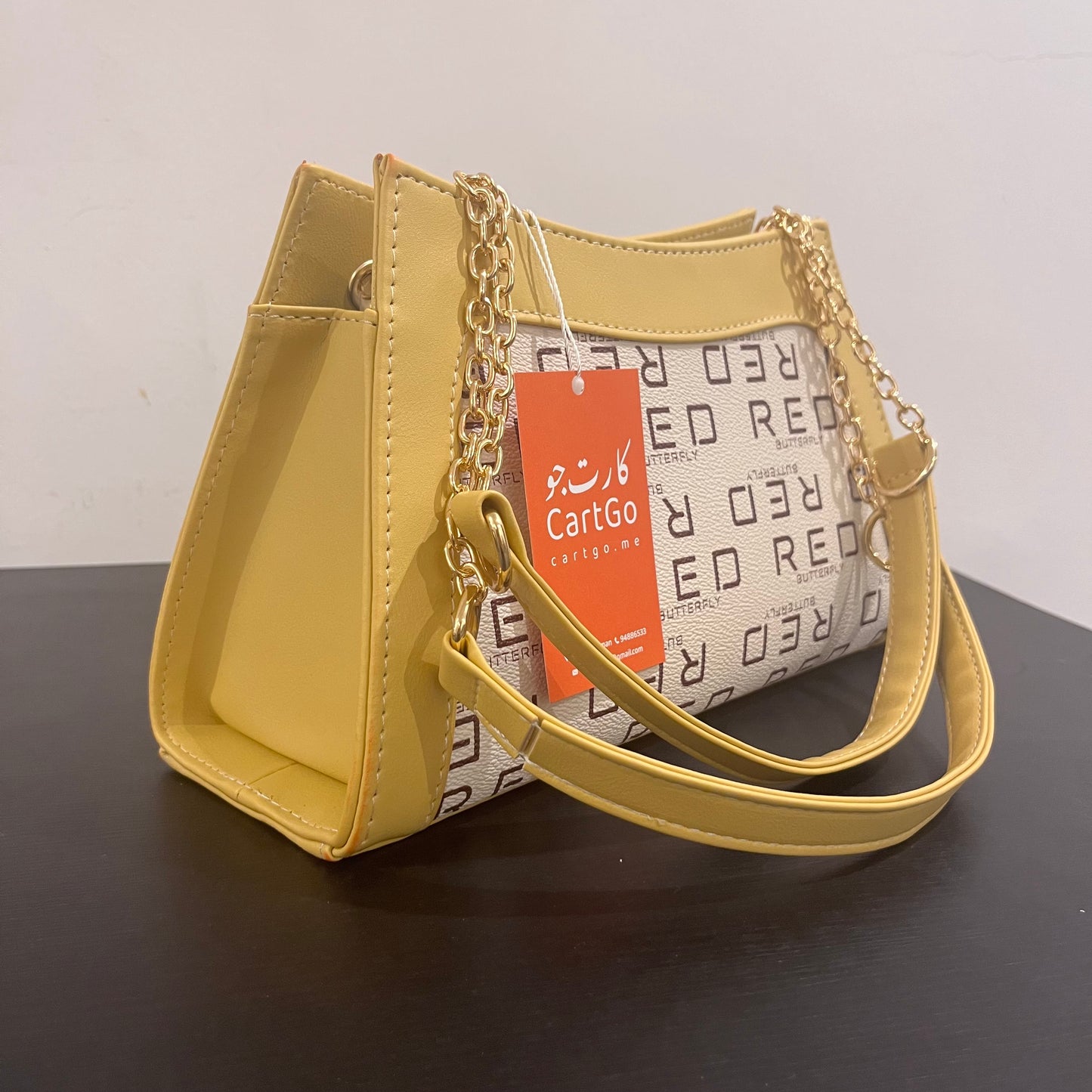 حقيبة لون خردلي بنمط أحرف Monogram patterned masterd color handbag
