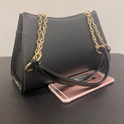 حقيبة سوداء بنمط  monogram patterned black handbag