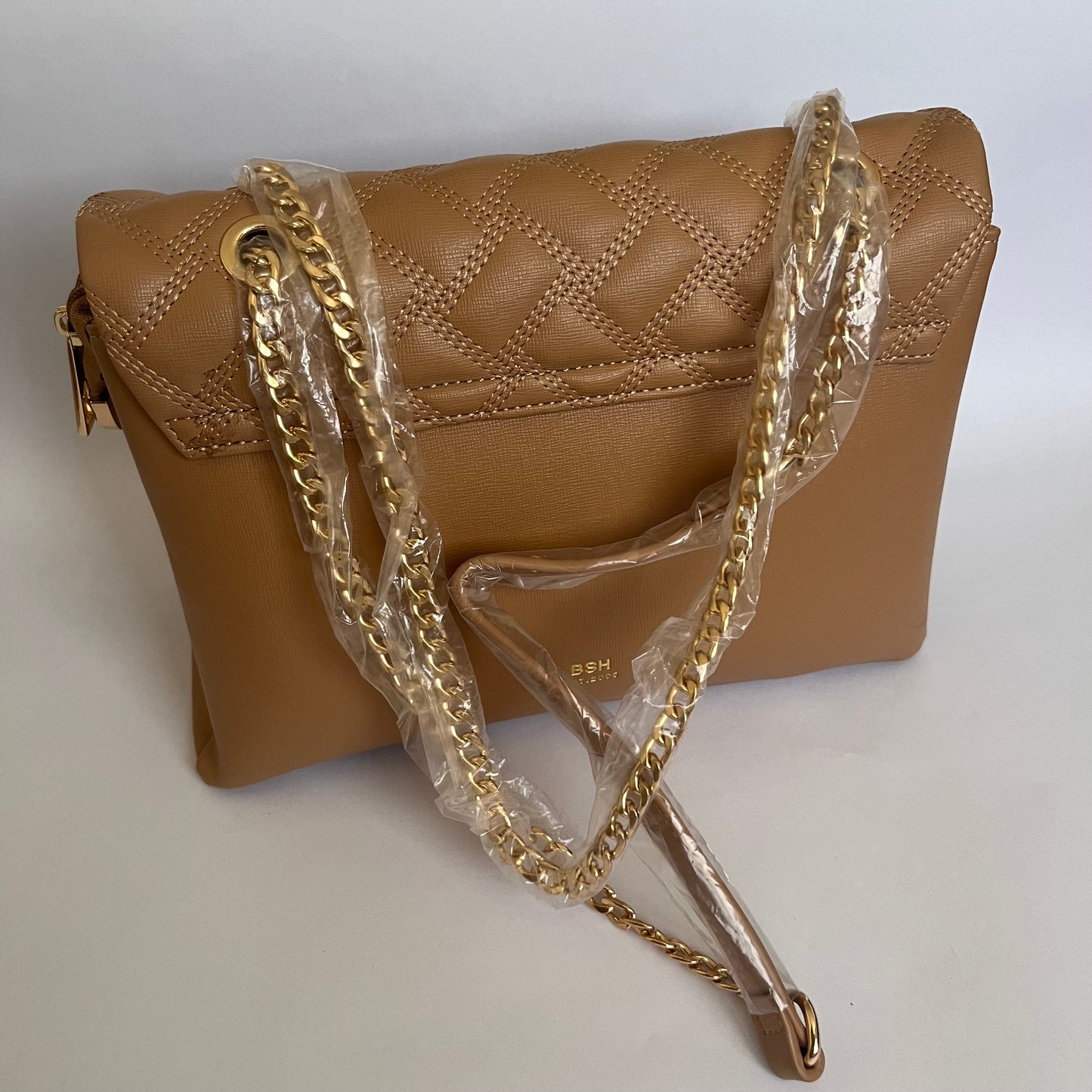 حقيبة يد بيج غامق مبطنة مزينة بشعار QUILTED EMBELLISHED EMBLEM TAUPE HAND BAG