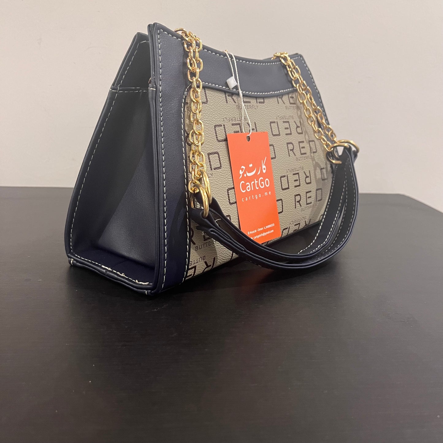 حقيبة لون كحلي بنمط أحرف  Monogram patterned navy blue color handbag