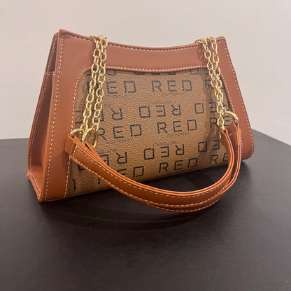 حقيبة لون بني بنمط أحرف  Monogram patterned brown color handbag