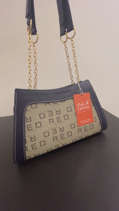 حقيبة لون كحلي بنمط أحرف  Monogram patterned navy blue color handbag